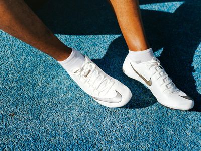 Close up of sports shoes and a bottle