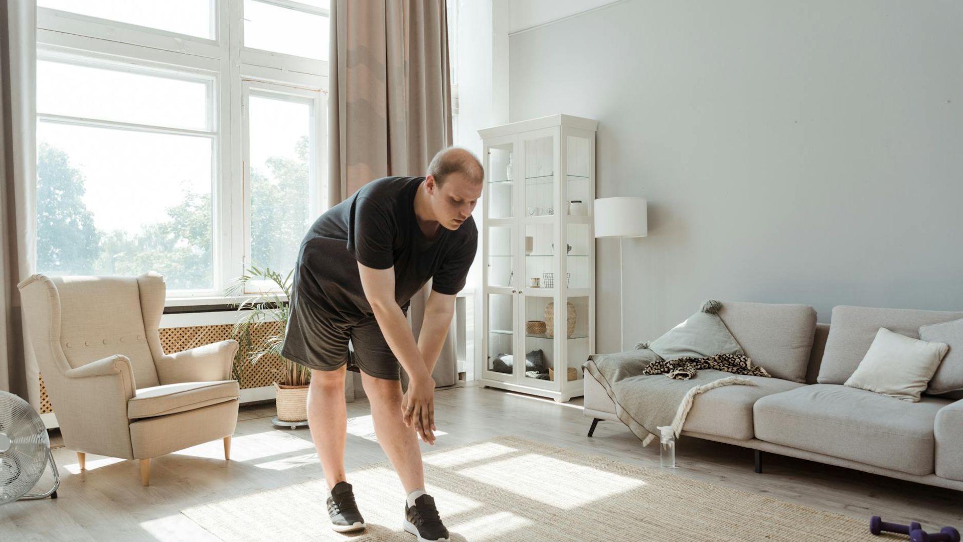 Person doing morning exercises in a bright room